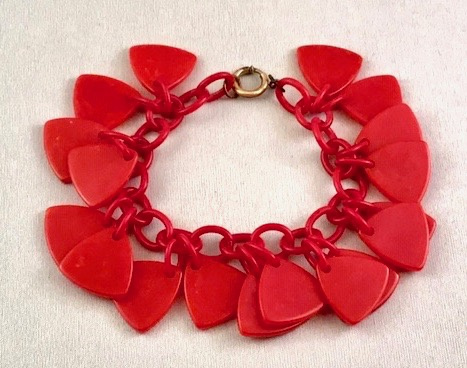 BB271 red bakelite charm bracelet